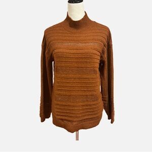 Burnt orange sweater.